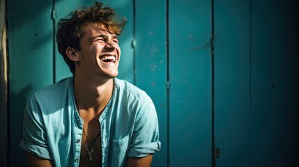Male model laughing heartily, his smile reaching his eyes and showcasing his genuine emotions.