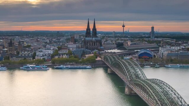Cologne skyline aerial view time lapse from day to night, cologne cathedral germany city panoramic view of old town, cologne river and bridge.
