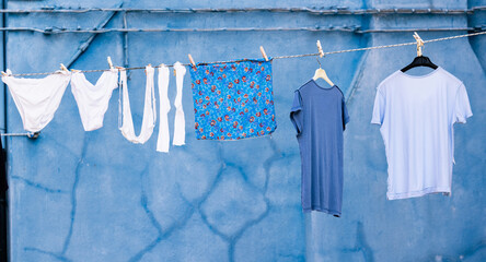 clothes drying in the sun - obrazy, fototapety, plakaty