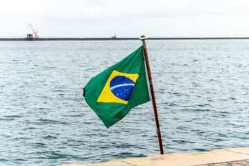 Brazilian flag placed on the Riachuelo S40 submarine, from the Brazilian navy, which is parked in the sea port of the city of Salvador, Bahia.
