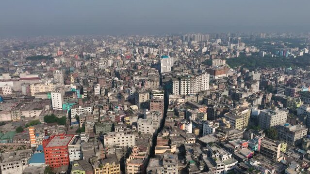 Aerial view of Dhaka city, the vibrant and bustling capital of Bangladesh. The cosmopolitan city is a blend of modern and traditional, with towering skyscrapers, bustling markets. Buriganga