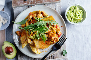 Fried potato wedges with avocado dip