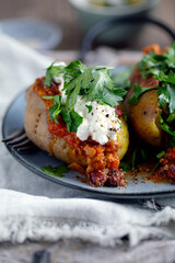 Baked potato with vegetables and cottage cheese on top