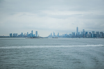 Fototapeta premium Staten island ferry on the hudson river in lower manhattan in New York city on a sunny day, United States.