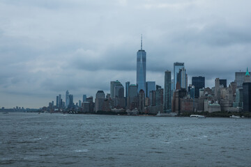 Naklejka premium Staten island ferry on the hudson river in lower manhattan in New York city on a sunny day, United States.