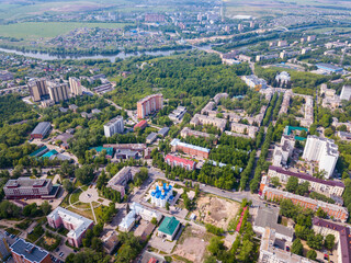 Aerial panoramic view of modern cityscape of Voskresensk overlooking Church of Icon of Mother of God of Jerusalem, Russia