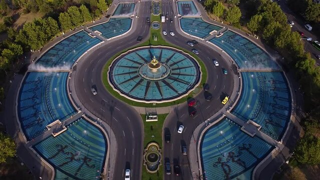 High angle drone footage of the Bucharest fountains at Piata Unirii. Union square seen from above in 4k. Beautiful summer cityscape aerial shot. 
