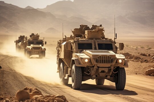Closeup of a group of military vehicles rolling through a desert landscape.