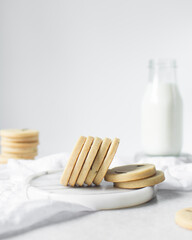 sugar cookies on a marble tray, stack of rosemary cookies on a white background, no spread round...