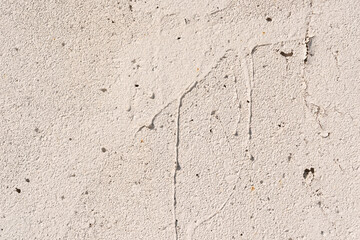 pastel paint with drip marks on a concrete wall