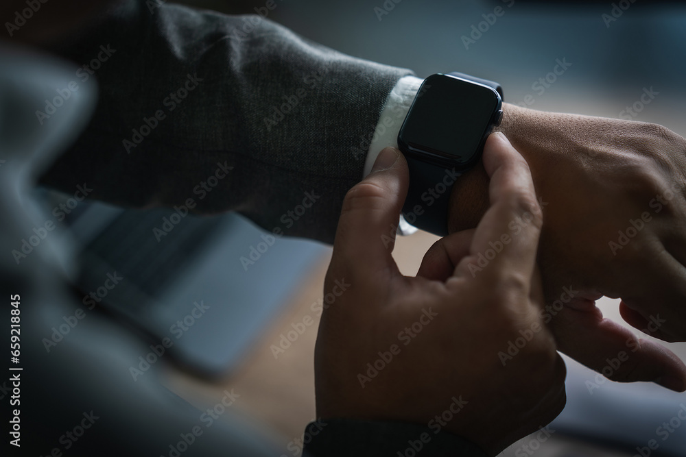 Poster man checking time on his smartwatch device close-up display clock checking lifestyle communication p
