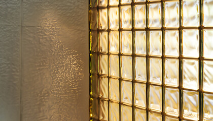 close up glass block wall with golden natural light background, interior design