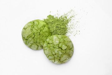Tasty matcha cookies and powder on white background, top view