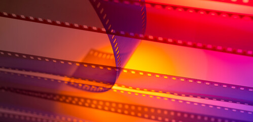 color background with a film. The current 35 mm film for the background of the banner - obrazy, fototapety, plakaty