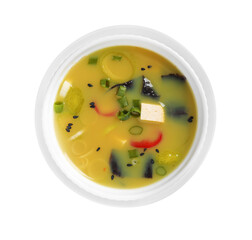 Bowl of delicious miso soup with tofu isolated on white, top view