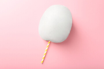 One sweet cotton candy on pink background, top view