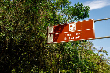 Street sign indicating Zona Rosa and El Poblado in Medellin, Colombia
