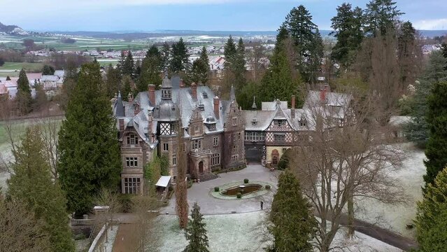 Drone photo, drone shot, video from front and top of Rauischholzhausen Castle in winter, snow, castle park, fountain, Ebsdorfergrund, Hesse, Germany, Europe