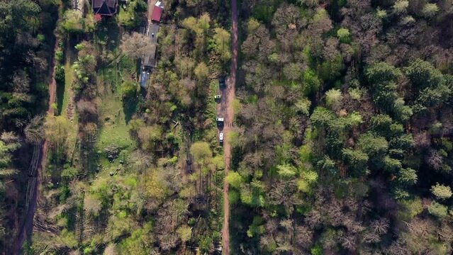 Drone shot, drone photo, drone flight, car park in the forest with camper vans at wild camping, Freiburg im Breisgau, Baden-Wuerttemberg, Germany, Europe
