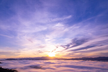 Amazing Sunrise or sunset over mountains hills covered with mist, Aerial view landscape drone shot beautiful colorful nature background