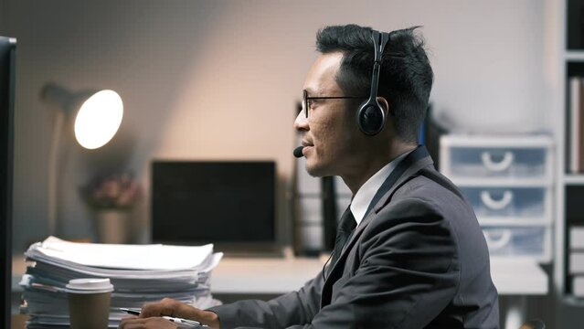 Call center, typing and business man on computer in office for customer service. Telemarketing, smile and male person on pc, sales agent or consultant working for support, consulting and help online.