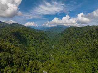 Aerial view of mountain range and mountain slopes with rainforest. Bukit Lawang. Sumatra, Indonesia.