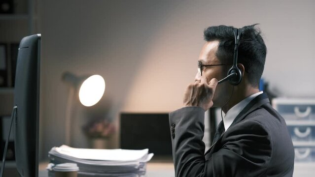 Call center, typing and business man on computer in office for customer service. Telemarketing, smile and male person on pc, sales agent or consultant working for support, consulting and help online.