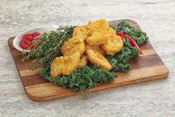 Crispy chicken nuggets with tomato ketchup