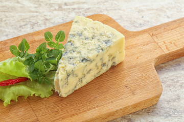 Blue cheese piece over board