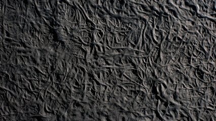 crumpled black paper textured background