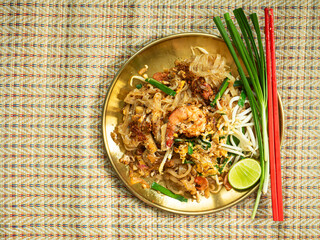 dish of Pad Thai on rattan mat