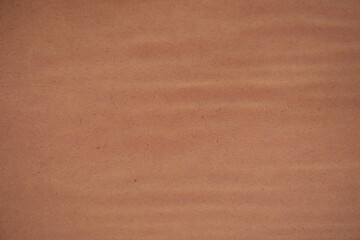 Brown waves corrugated cardboard texture background. Brown paper cardboard with soft color. Brown corrugated cardboard texture is useful as a background.