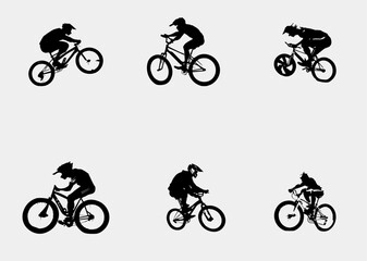 Fototapeta premium Silhouette of boys riding a bmx bicycle