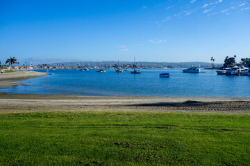 Fototapeta na wymiar Boats and yachts anchored in Santa Barbara Cove at Mission Bay, San Diego, California