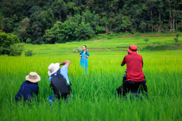 Photographers taking pictures model at rice terrace Ban Pa Bon Piang, Chiang Mai Thailand,