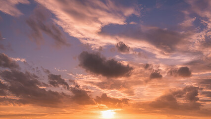Obraz premium Panoramic view of sunset golden and blue sky nature background. Colorful dramatic sky with cloud at sunset.Sky background.Sky with clouds at sunset.