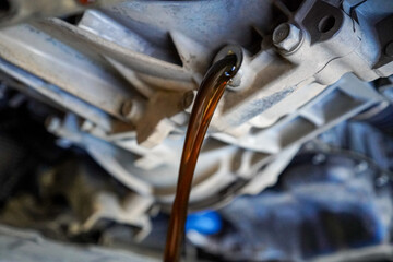 Close up view of a Maintenance Car service - auto oil change, motor check, brake cleaning, tire...