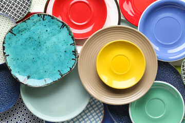Many colorful ceramic plates as background