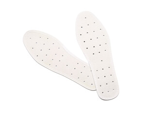 Pair of orthopedic insoles on white background