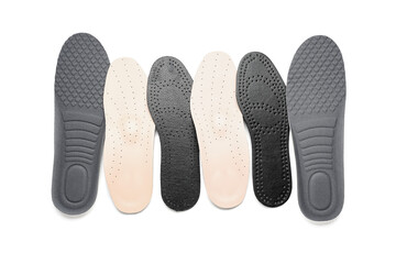 Set of different orthopedic insoles isolated on white background
