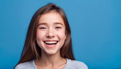 Fototapeta premium portrait of a girl on blue background 