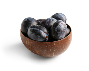 Bowl with ripe plums on white background