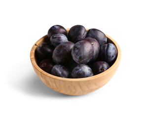 Bowl with ripe plums on white background