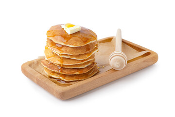 Wooden board of tasty pancakes with butter and maple syrup on white background