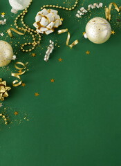 Christmas background template top view with copy space. Golden Xmas decor frame on green backdrop .Beautiful Xmas greeting card.New Year decor frame mockup .