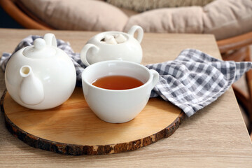 Tea set on table in living room, closeup