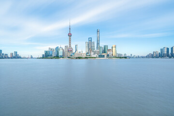 Fototapeta na wymiar Illuminated Shanghai Skyline Reflecting On River 