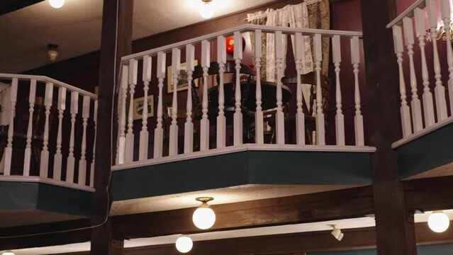 A balcony with a white railing.