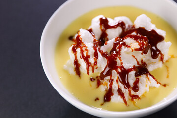 floating island with custard cream and caramel ( Ile flottante, French food)