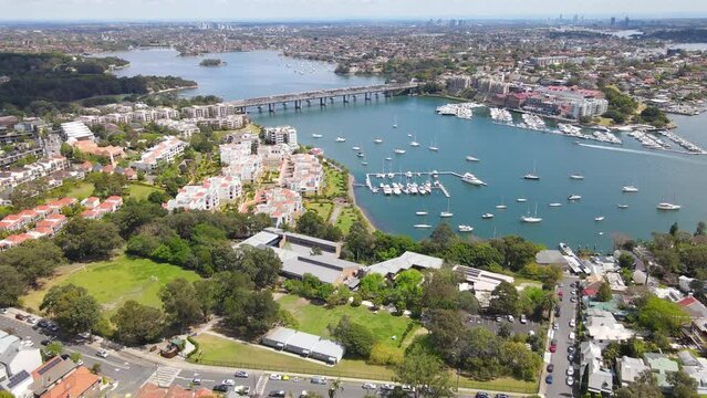 Aerial drone view over Balmain in Sydney, New South Wales, Australia looking toward Sommerville Point and Birkenhead Point on a sunny day    